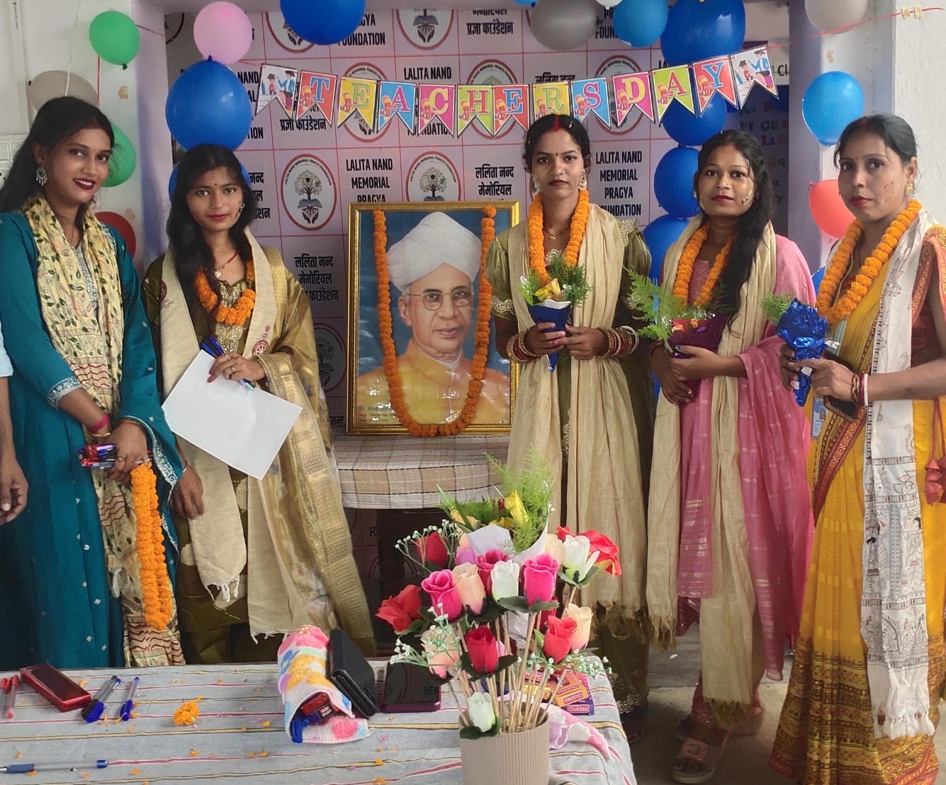 Teachers honoured on Teachers' Day, beside Dr. Radhakrishnan's portrait