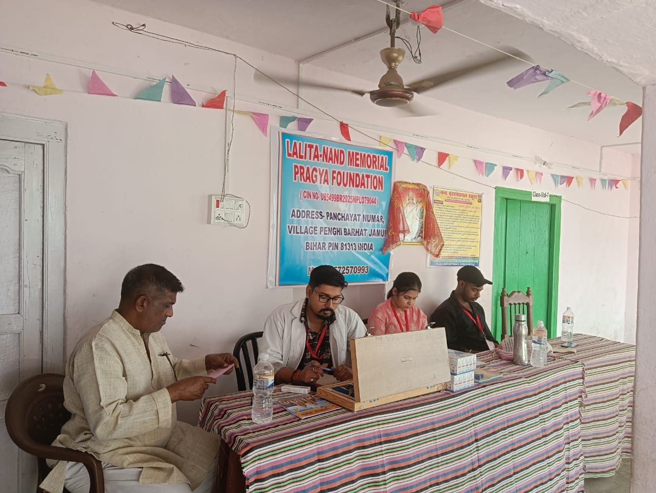 Foundation volunteers registering patients at a free health camp